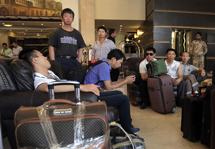 Chinese workers await evacuation from Baghdad, Iraq.